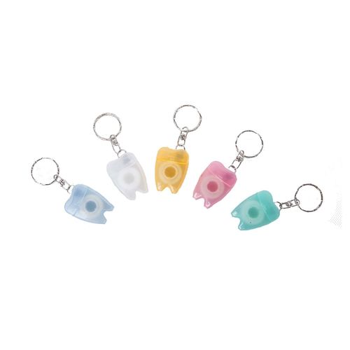 Keychain in tooth shape dental floss